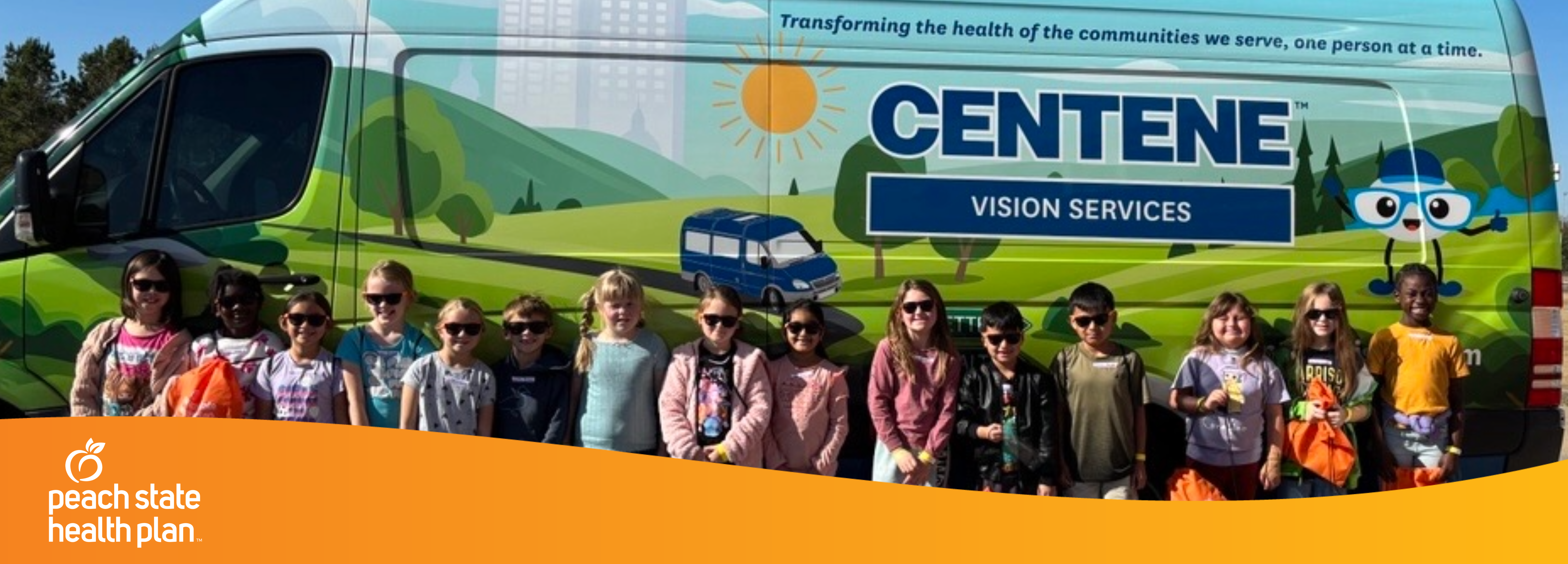 children standing in front of the vision van